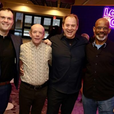 From left, Gord St. Denis with his coach, Pierre Brault, and Rick Currie with his mentee, Jim Carty. Photo by Caroline Phillips